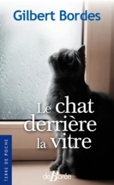 Le chat derrière la vitre